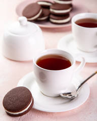 cup of tea and homemade chocolate sandwich cookies