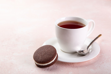cup of tea and homemade chocolate sandwich cookies