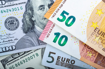 Euro bills. Different denominations on a gray background. 5, 10, 50 euros.
