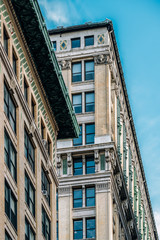 Close view of ornament on the building exterior of American Woolen Building in Gramercy district New York City