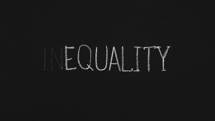 Word Equality written with chalk on blackboard