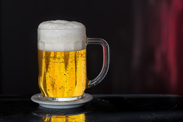 Glass of beer with drops of water