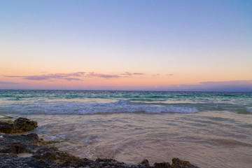 Fototapeta na wymiar Sunrise over the beach of the Mayan Riviera in Tulum, Quintana Roo, Mexico