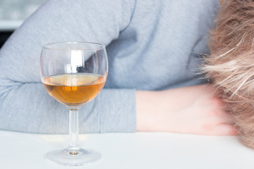 alcoholic woman and glass of alcohol
