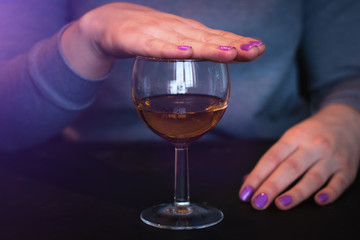 young woman refuses to drink alcohol