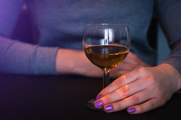 young woman and a glass with alcohol