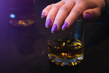 young woman covers her glass with her hand. alcohol rejection