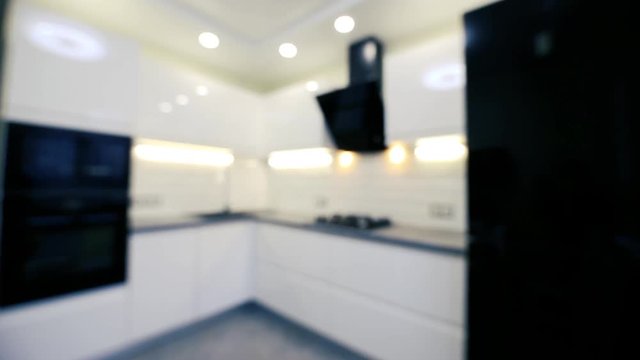 blurred background of modern white kitchen