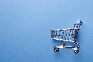 Shopping concept.  shopping cart on a blue background.