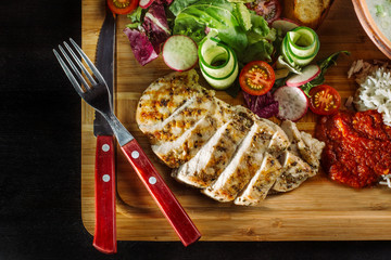 Laid dinner on the table, onion and egg soup, rice, chicken breast.