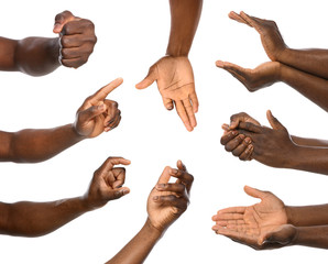 Afro-American man showing different gestures on white background, closeup view of hands