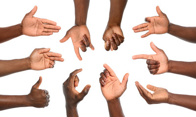 Afro-American man showing different gestures on white background, closeup view of hands