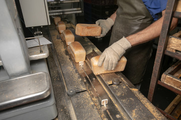 Manufacture of bread. Conveyor with dough. Capacity of the dough. Kneading dough at the bakery. Workshop of the manufacture dough.