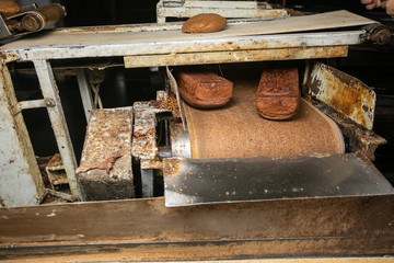 Manufacture of bread. Conveyor with dough. Capacity of the dough. Kneading dough at the bakery. Workshop of the manufacture dough.