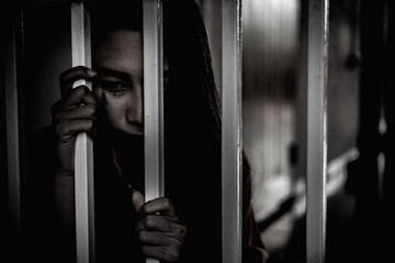 Hands of women desperate to catch the iron prison,prisoner concept,thailand people,Hope to be free.