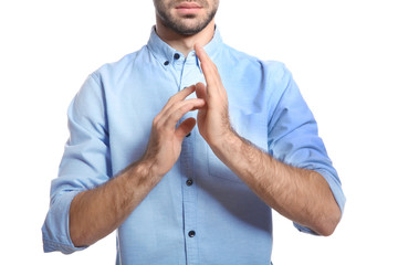 Man showing JESUS in sign language on white background, closeup