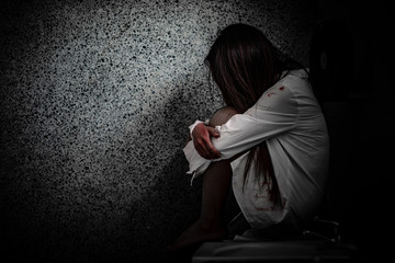 Portrait of asian woman make up ghost face with blood,Horror scene,Scary background,Halloween...