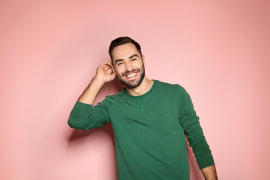 Portrait Of Handsome Young Man On Color Background