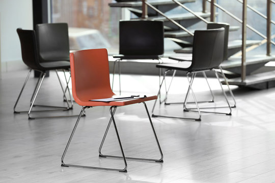 Red Chair With Clipboard In Office Prepared For Group Therapy. Meeting Room Interior