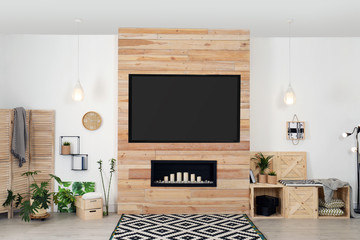 Living room interior with modern TV on wooden wall