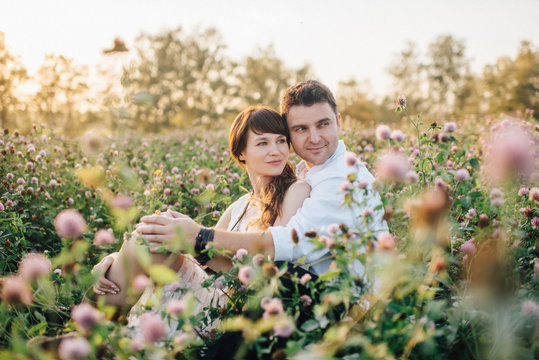 Love story of beautiful young couple at nature