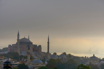 Naklejka premium Hagia Sophia and the Bosphorus in the early summer morning mist.