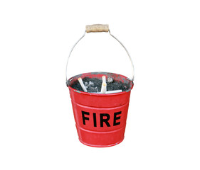 ashtray in the form of a small red fire bucket with the inscription FIRE isolated on white background closeup