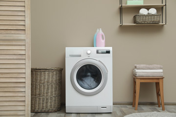 Washing machine with dirty towel in laundry room