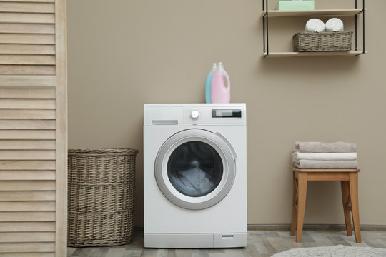 Washing Machine With Dirty Towel In Laundry Room