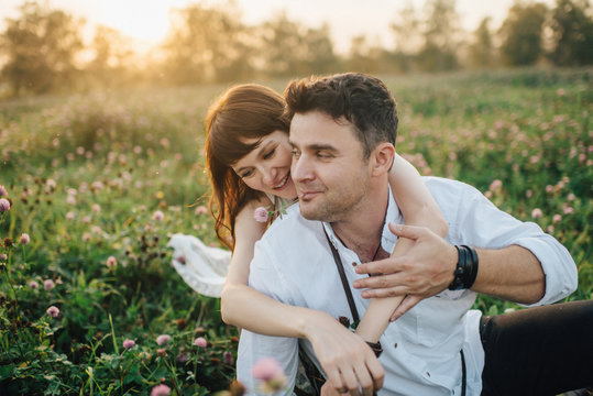 Love story of beautiful young couple at nature