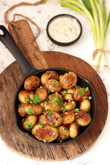Baked potatoes with garlic and herbs