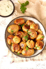 Baked potatoes with garlic and herbs