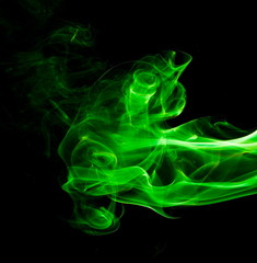 Green smoke on black background
