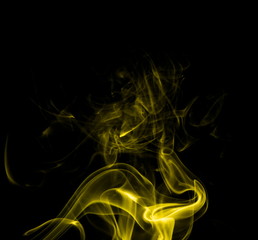 Yellow smoke on black background