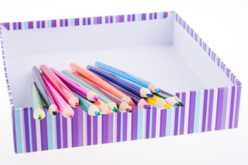 A box of color pencils. concept of storage of goods for creativity