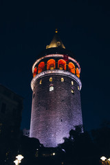Obraz premium Ancient landmark Galata tower lit by lights in the evening