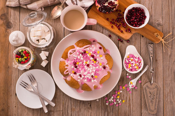 Cake with pink frosting. 