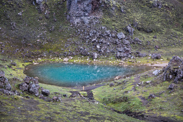 A small azure lake in the colored mountains of Landmannalaugar