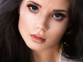 Beautiful woman face close up studio on white.