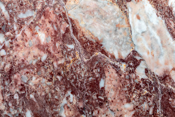 close up of a polished red marbled granite texture