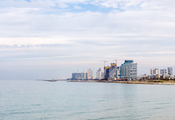 Tel Aviv, Israel. View of the Tel Aviv promenade with modern skyscrapers along the seacoast.