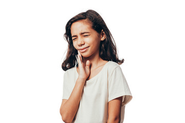 Portrait of young girl suffering with toothache on white background
