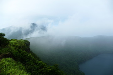 Onami Ike emerging from the fog, Ebino kogen, Kyushu, Japan
