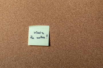 green sticker on brown table. color sticker, motivational, quote and words, note, message