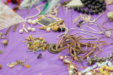 variety of jewellery on purple table