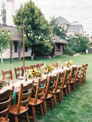 Fototapeta na wymiar Table settings for a luxury wedding reception. Outdoor wedding