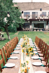 Table settings for a luxury wedding reception. Outdoor wedding