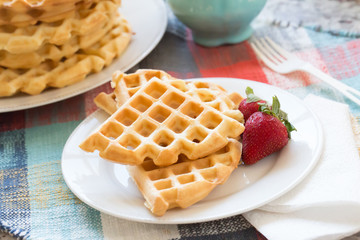 a stack of plain round waffles