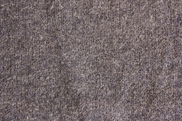 Grey texture background of empty seamless cloth pattern. Simple blank backdrop of light gray washed out color material to use as template, banner, mock up or wallpaper, cloe up top view from above