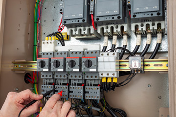 Chiller engineer testing a wiring circuit